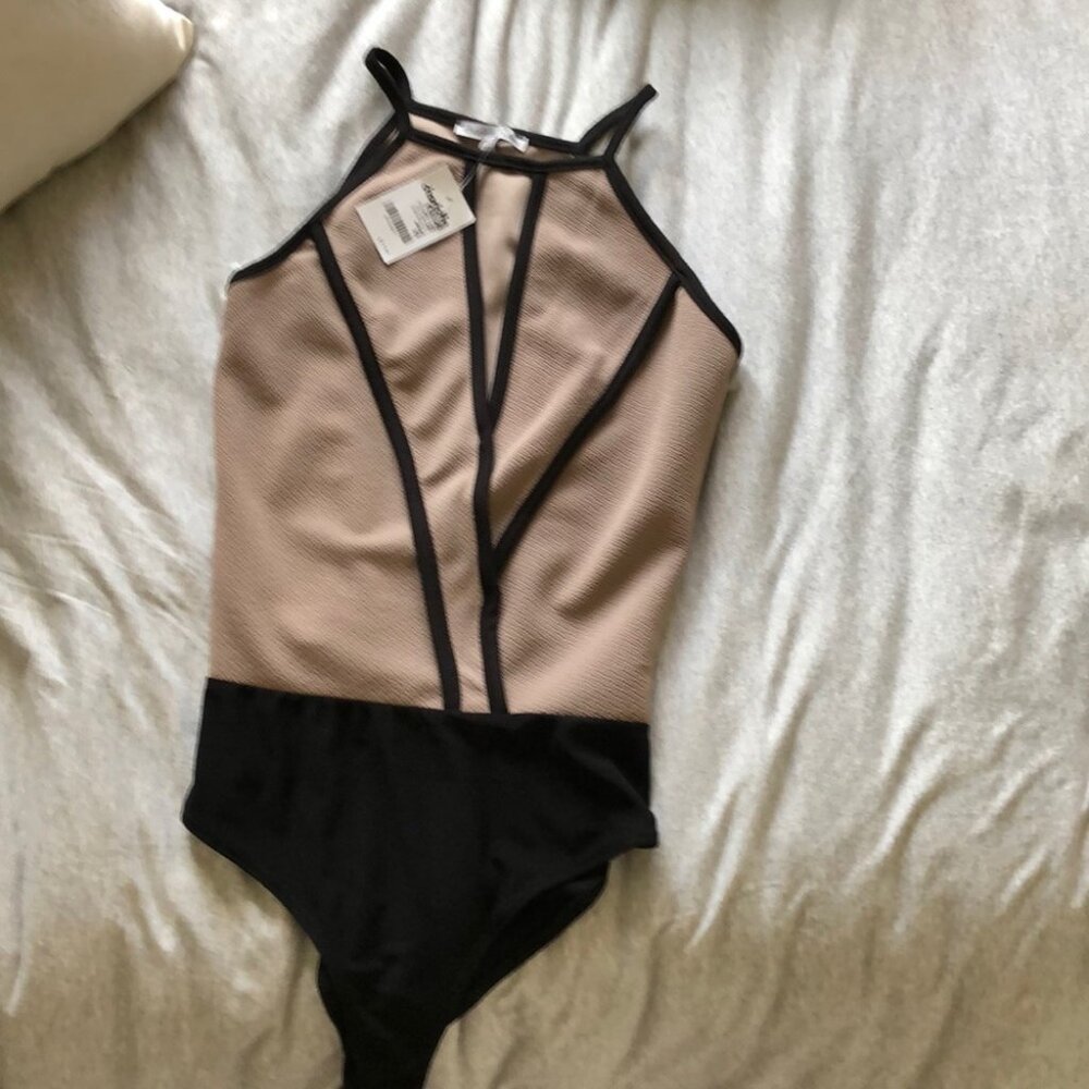 Nude/black body suit